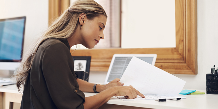 Entrepreneur reviewing franchise disclosure documents.