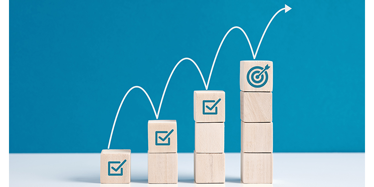 Wooden blocks of differing heights depicting objectives in planning. 