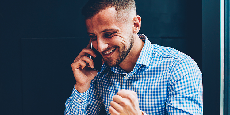 Man on a cell phone making a verbal offer.