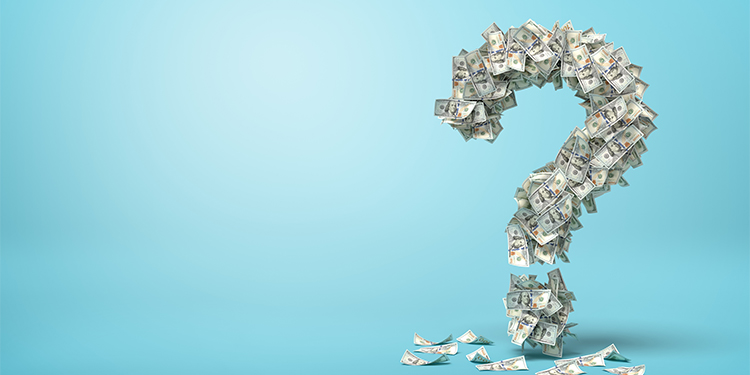 A question mark created from dollar bills against a blue background.