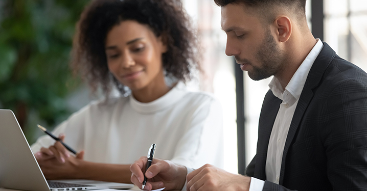 Business owners negotiating seller financing for a business transaction.