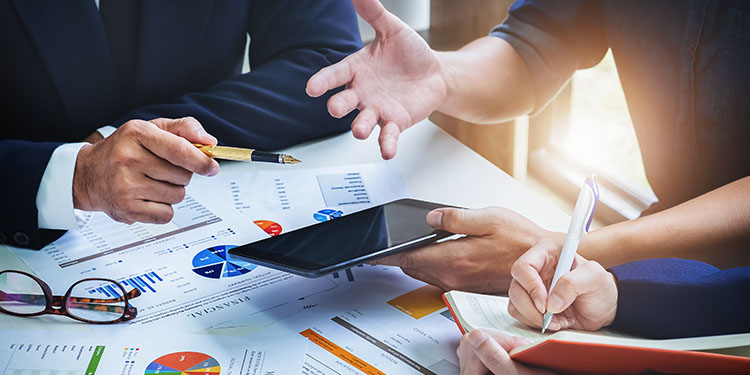 Business owners evaluating valuation documents. 
