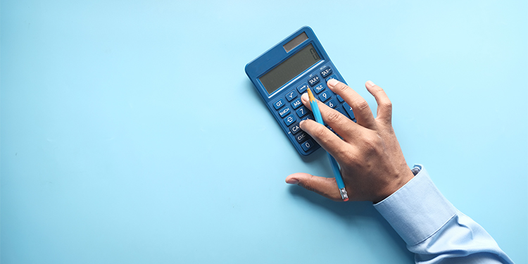 A dark blue calculator on light blue background.